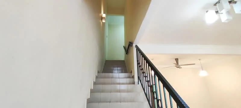 Room features: staircase with tiled steps, white painted walls, black metal railing, ceiling lights, ceiling fan, neutral color scheme; style: modern.