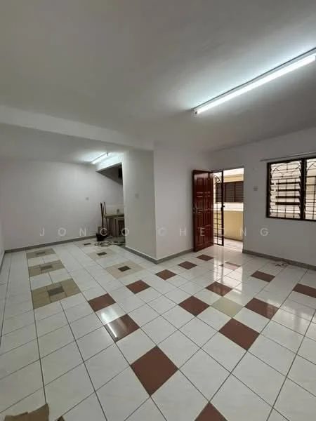 Room features: white painted walls, tile flooring with brown and cream accents, ceiling lights, windows with grilles, open layout, door leading outside, corner area for kitchen, neutral color scheme; style: modern.