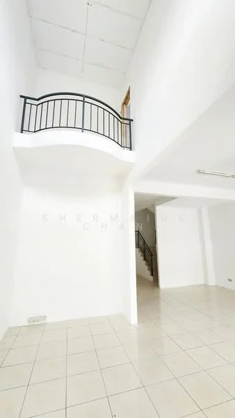 Room features: white painted walls, tiled flooring, high ceiling, balcony with black railing, staircase leading to upper level, open space layout, natural light from windows, neutral color scheme; style: modern.