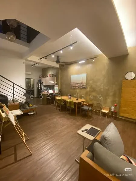 Living features: wooden flooring, exposed concrete accent wall, recessed downlights, pendant lighting, dining table with chairs, sofa, wall clock, open shelving, artwork on display, large windows, kitchen area visible in background; style: modern.