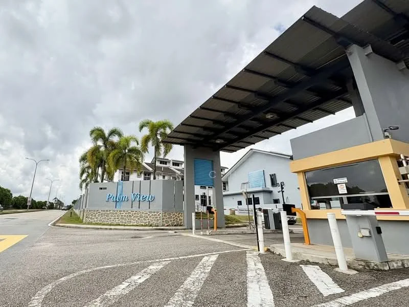 Exterior type: main entrance gate; features: guard house at entrance, security boom gate, palm trees, signage with 'Palm View', paved driveway, surrounded by greenery; style: modern.