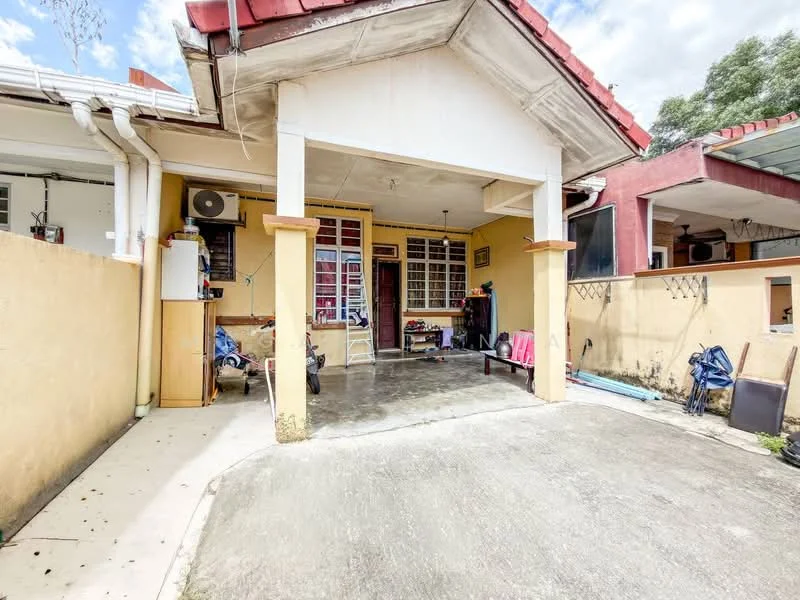 Exterior type: linked terrace house; features: red tiled roof, yellow painted facade, concrete driveway, covered porch area, air conditioning unit on wall, front garden area, exposed brick wall, outdoor seating area, fenced perimeter, visible outdoor storage, manicured lawn; style: modern.