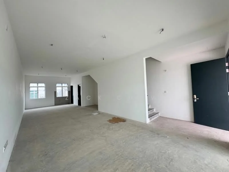 Room features: white painted walls, concrete flooring, multiple windows, staircase visible, doorway leading outside, no visible furniture or decor, unfinished space, ceiling lights, open layout; style: minimalist.