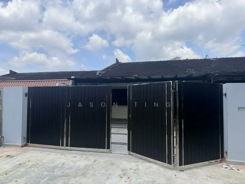 Exterior features: double-gate entrance, black wooden gates, concrete driveway, partially visible building structure, cloudy sky, surrounding residential area; style: modern.