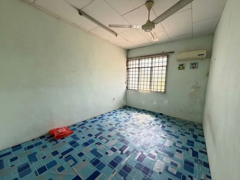 Room features: light blue painted walls, white ceiling, ceiling fan, window with metal grille, air conditioning unit, blue and white patterned floor tiles.