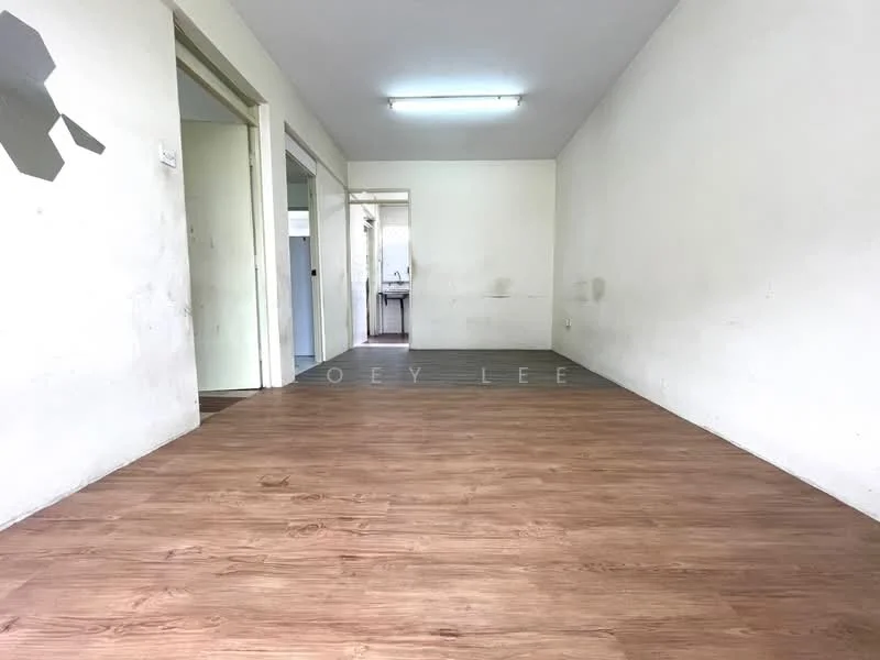 Room features: laminate flooring, white painted walls, doorway leading to another room, doorway leading to kitchen area, natural light from windows, plain ceiling, no visible furniture; style: minimalist.