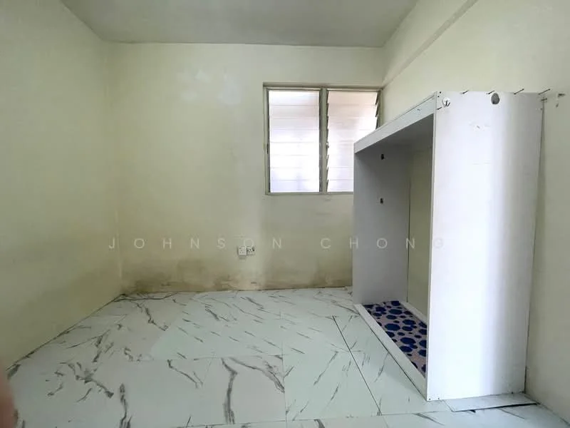 Room features: white painted walls, marble tile flooring, window with horizontal slats, built-in cabinet structure, visible electrical outlets.