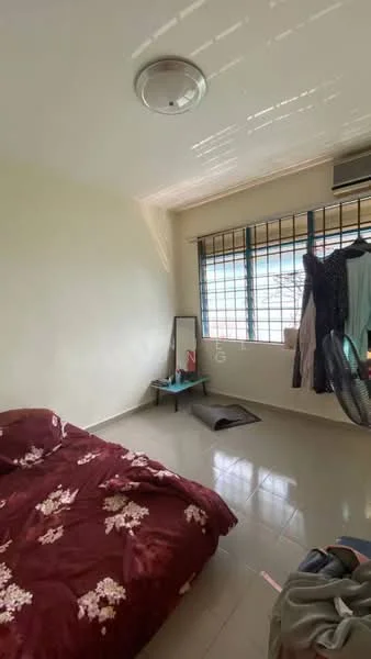 Bedroom features: queen-size bed with floral bedding, floor-to-ceiling windows, window with metal grille, light-colored painted walls, glossy tile flooring, ceiling light fixture, mirror on stand, clothing rack with hanging clothes, wall-mounted air conditioning unit, small table beside bed, area rug.