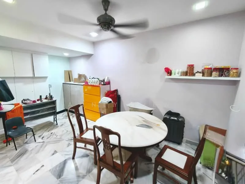 Dining features: round marble dining table, 4 wooden dining chairs, ceiling fan, white painted walls, marble flooring, shelves with decorative items, orange storage cabinet, black storage unit, small black chair, suitcase, various jars on shelf; style: modern.