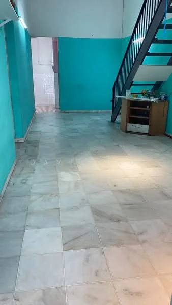 Room features: marble tile flooring, turquoise painted walls, staircase with metal railing, open layout, natural light from upper level, small cabinet or console table, decorative items on table; style: modern.