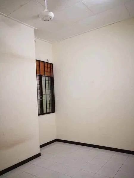 Room features: white painted walls, plain ceiling, ceiling fan, window with metal grille, tile flooring, corner location, neutral color scheme, no visible furniture; style: minimalist.