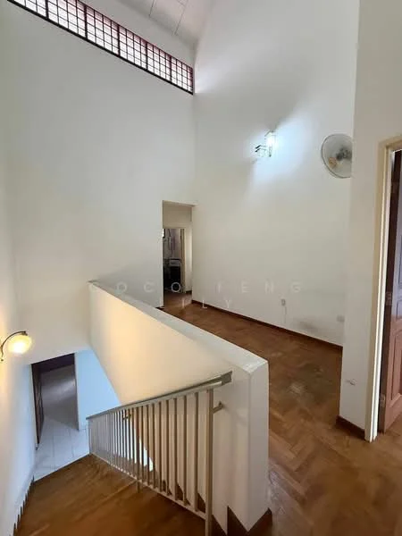 Room features: white painted walls, wood flooring, staircase with railing, ceiling fan, wall-mounted light fixture, high ceiling, window with decorative grille, open space layout; style: modern.
