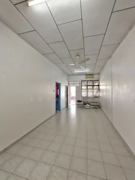 Room features: white painted walls, tile flooring, suspended ceiling with grid, fluorescent ceiling lights, window with metal grille, open space layout, no visible furniture, neutral color scheme; style: minimalist.