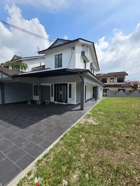 Exterior type: detached bungalow; features: white painted facade, flat roof, 2-storey structure, large covered porch, grey tiled flooring, manicured lawn, surrounded by greenery, windows with black frames, open space in front, concrete driveway; style: modern.