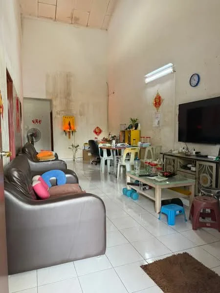 Living features: brown leather sofa, colorful cushions, glass coffee table, white tiled flooring, wall-mounted TV, decorative wall clock, wall-mounted light fixture, fan, dining table with chairs, yellow cabinets, decorative wall art, area rug.