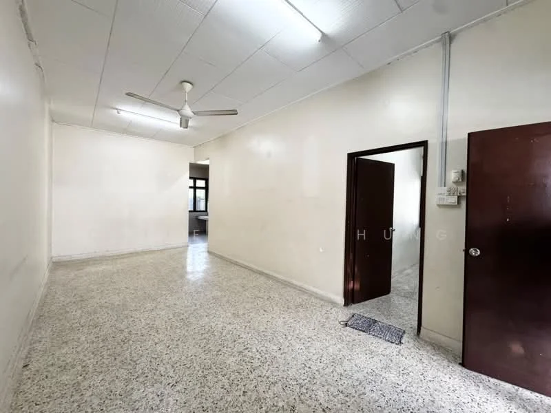 Room features: white painted walls, polished concrete flooring, ceiling fan, doorway leading to another room, doorway leading to kitchen area, light fixtures on ceiling, neutral color scheme, no visible furniture; style: minimalist.