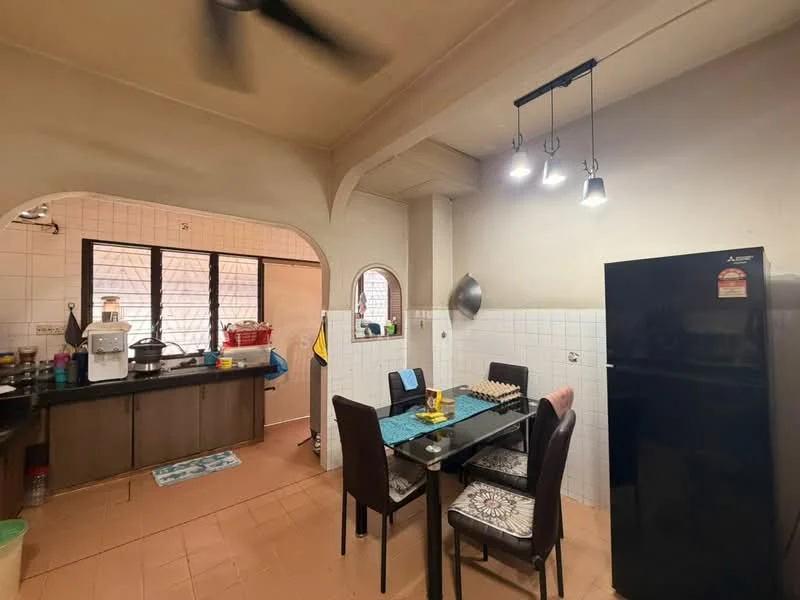 Dining features: dining table with four chairs, pendant lighting, tile flooring, white tiled walls, black refrigerator, arched doorway, ceiling fan, decorative wall shelf. Kitchen features: kitchen counter with cabinets, sink, microwave, stainless-steel pot, open shelving, tile flooring, white tiled walls, window with black frame.