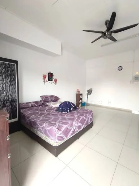 Bedroom features: queen-size bed with patterned bedding, ceiling fan, white painted walls, tile flooring, nightstand, wall clock, decorative wall art, window with no visible treatment, standing fan, built-in wardrobe.