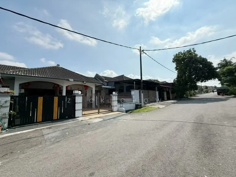 Exterior type: linked terrace house; features: single-storey, white painted facade, black gate with wooden accents, tiled roof, manicured lawn, paved driveway, front porch, surrounded by greenery; style: modern.