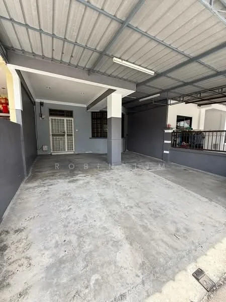 Exterior type: car porch; features: concrete flooring, roof with metal sheeting, grey painted walls, single entrance door, security grille door, overhead lighting fixtures, open space, adjacent to residential building; style: modern.