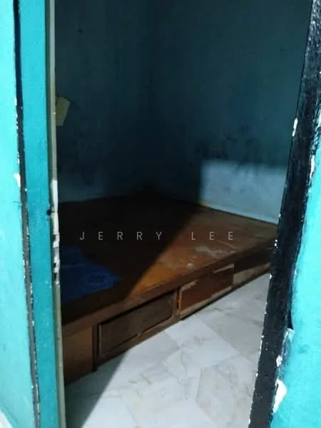 Room features: blue painted walls, wooden platform bed, marble tile flooring, built-in storage drawers, single light fixture.