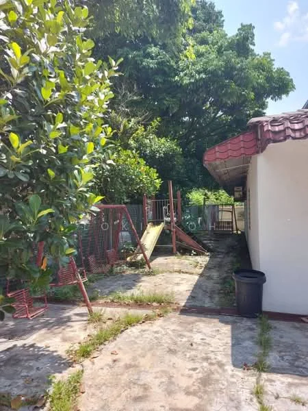 Exterior features: paved walkway, fenced area, playground equipment, mature trees, grass patches, red tiled roof, white painted facade, outdoor space with potential for landscaping.