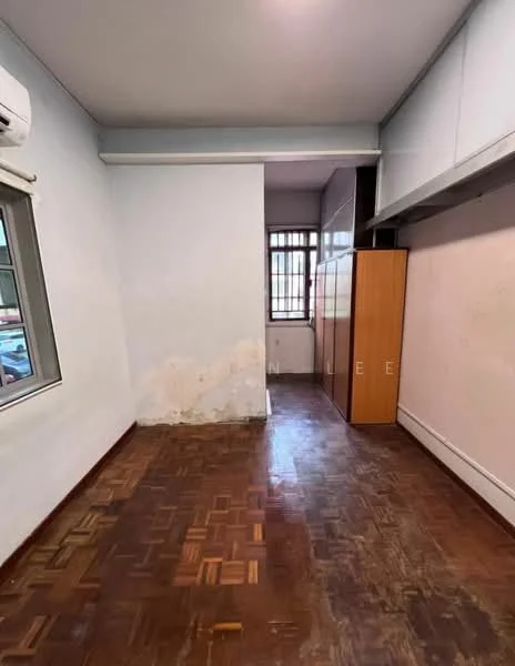 Room features: white painted walls, parquet wood flooring, 1 wall-mounted split AC, built-in wardrobe, window with metal grille, natural light from window.