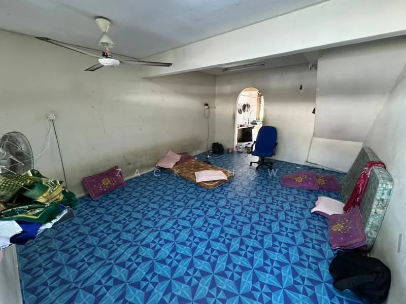Room features: blue patterned tile flooring, white painted walls, ceiling fan, wall-mounted fan, two floor cushions, one mattress, office chair, arched doorway, window, unfurnished space; style: minimalist.
