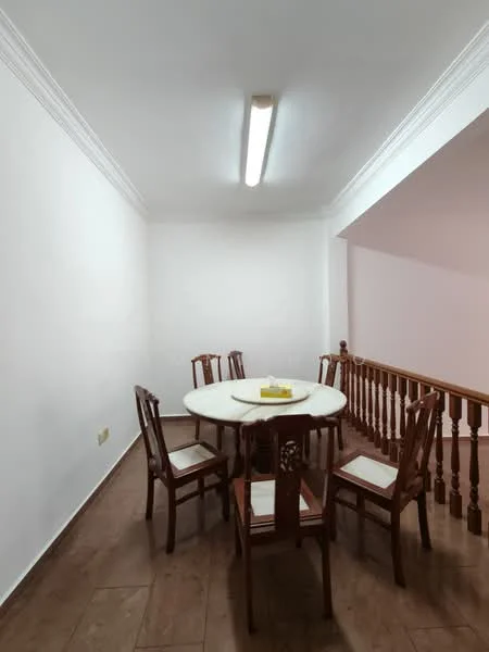 Dining features: round dining table, 6 wooden dining chairs, white walls, wooden railing, laminate flooring, ceiling light fixture, decorative ceiling moulding; style: minimalist.