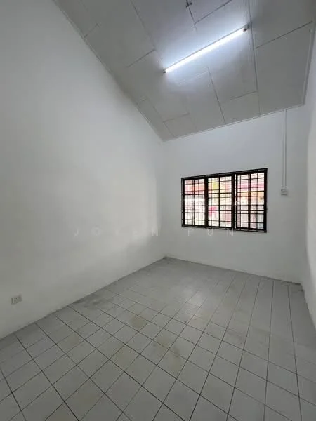Room features: white painted walls, tile flooring, sloped ceiling, large window with black grille, no visible furniture, neutral color scheme, bright overhead lighting; style: minimalist.