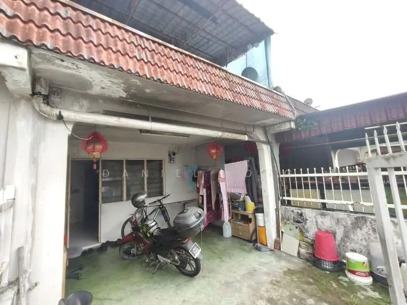 Exterior type: linked terrace house; features: red tiled roof, white painted facade, ground floor entrance, motorbike parked, outdoor area with green flooring, visible laundry hanging, decorative lanterns, fenced area, windows with grills; style: traditional.