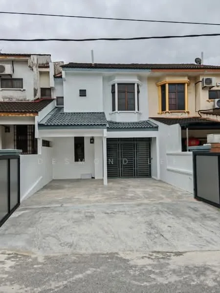Exterior type: semi-detached house; features: white painted facade, grey tiled roof, front driveway with concrete surface, metal gate, two-storey structure, decorative window with arch, air conditioning units visible on facade, mature trees in vicinity; style: modern.