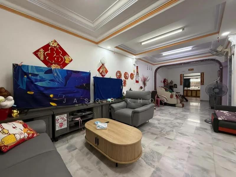 Living features: grey leather sofa, 3-seater fabric sofa with decorative cushions, coffee table with round top, marble flooring, white painted walls, crown moulding, wall-mounted fan, decorative wall hangings, red and gold decorations, open layout to adjacent room; style: traditional.