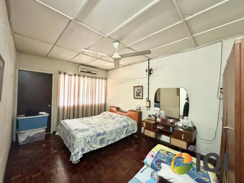 Bedroom features: queen-size bed with blue patterned bedding, single bed with white bedding, wooden bedside table, wall-mounted mirror, ceiling fan, wall-mounted air conditioning unit, wooden wardrobe, brown parquet flooring, striped curtains, decorative wall art.
