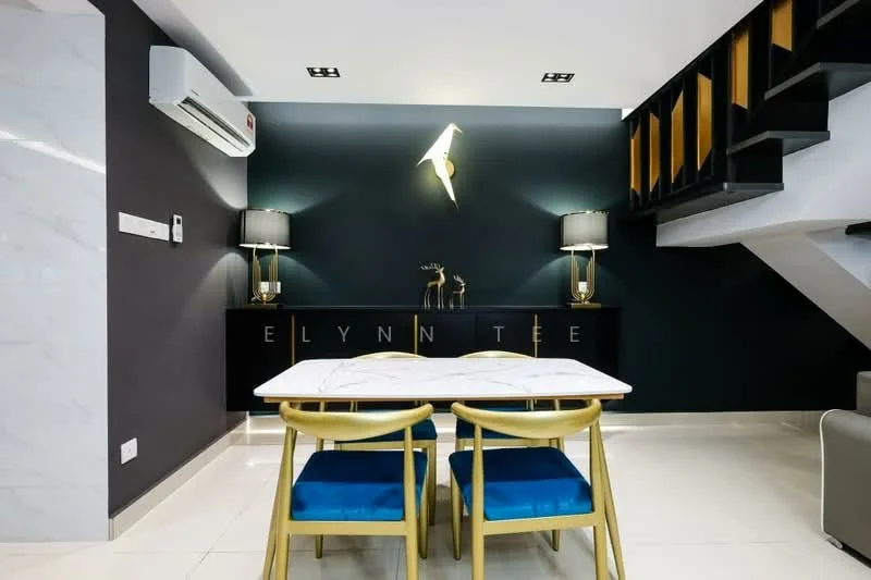 Dining features: marble dining table, golden dining chairs with blue upholstery, dark feature wall, white tiled flooring, recessed ceiling lights, 2 table lamps on side console, decorative wall art, air conditioning unit mounted on wall; style: modern.