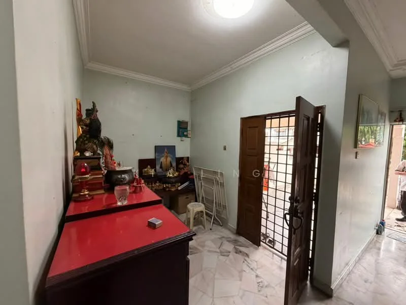 Room features: light green painted walls, white ceiling with crown moulding, marble tile flooring, wooden door, metal security grille door, decorative wall art, small table, red cabinet, seating chair; style: traditional.