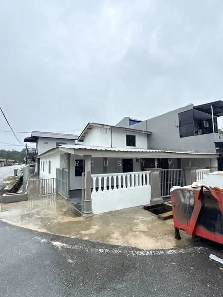 Exterior type: detached bungalow; features: white painted facade, pitched tile roof, front porch with railing, concrete driveway, surrounding pavement, single-storey, gated entrance, adjacent to road; style: traditional.
