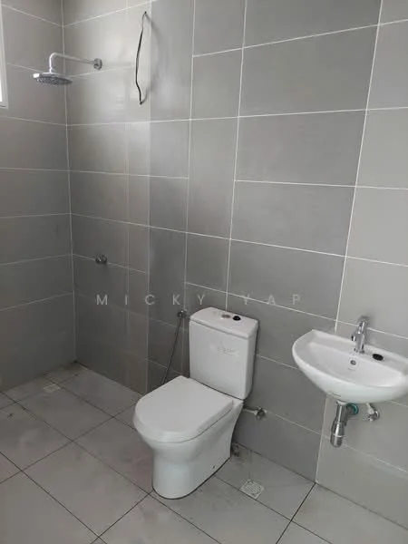 Bathroom features: grey tiled walls, white ceramic toilet, white wall-mounted sink, chrome faucet, shower head with wall mount, grey tiled flooring, window for natural light, shower area; style: modern.