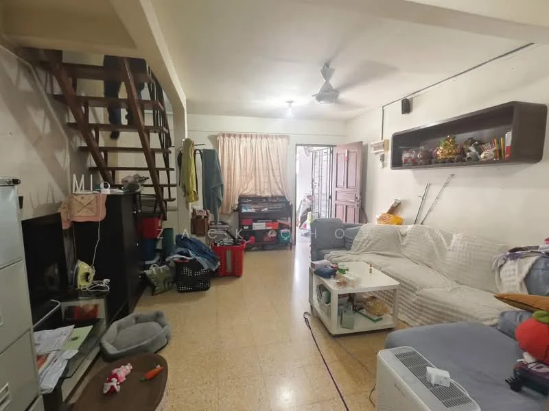 Living features: sofa with white cover, coffee table, wooden shelving unit, ceiling fan, staircase leading to upper level, curtains, tile flooring, decorative items on shelves, storage boxes, open space layout.