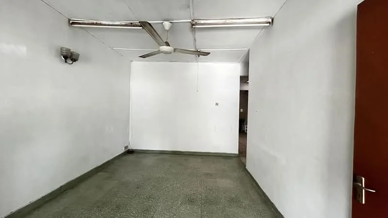 Room features: white painted walls, concrete flooring, 5-blade ceiling fan, wall-mounted light fixtures, exposed ceiling, no visible furniture, open layout, neutral color scheme; style: minimalist.