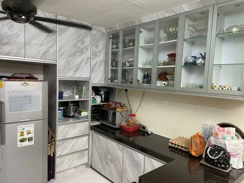 Kitchen features: grey marble countertop, grey cabinetry with glass-front upper cabinets, built-in microwave, stainless-steel fridge, kitchen sink, wall-mounted cabinet, decorative dishware on display, black countertop, ceiling fan; style: modern.