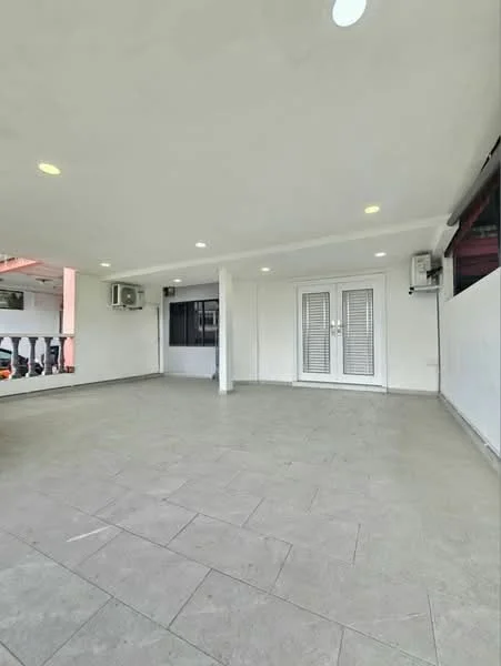 Room features: white painted walls, grey tile flooring, 2 wall-mounted split ACs, recessed downlights, double French doors with glass panels, large window, open layout, no visible furniture or decor; style: modern.