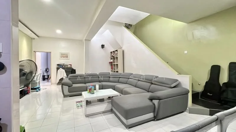 Living features: L-shape sectional sofa in grey, white coffee table, white tiled flooring, green painted walls, built-in shelves, wall-mounted lighting, ceiling lights, fan, staircase, open layout, decorative items on shelves; style: modern.
