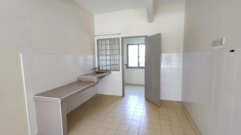 Kitchen features: white tiled walls, cream tiled flooring, single-bowl stainless-steel sink, window with grid design, countertop with storage space, door leading to another room, natural light from window.