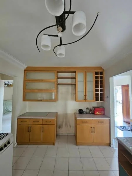Kitchen features: wood cabinetry with glass-front upper cabinets, white countertop, stainless-steel sink, chrome faucet, built-in wine rack, tile flooring, recessed downlights, wall-mounted cabinet, open shelving, gas stove, neutral wall color, crown moulding; style: modern.