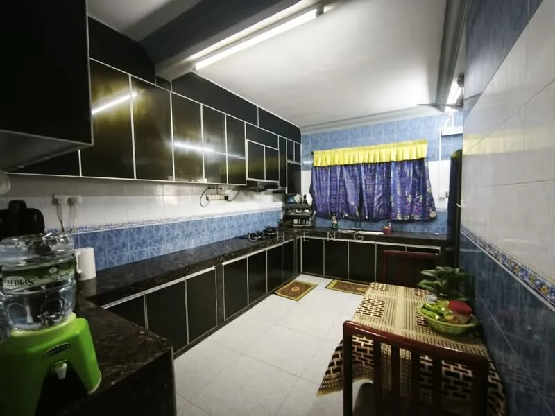 Kitchen features: black cabinetry with glossy finish, granite countertop, blue tiled backsplash, white tiled walls, grey tiled flooring, double-bowl stainless-steel sink, chrome faucet, built-in gas stove, exhaust hood, water dispenser, window with blue curtains, dining table with tablecloth, decorative plants; style: modern.