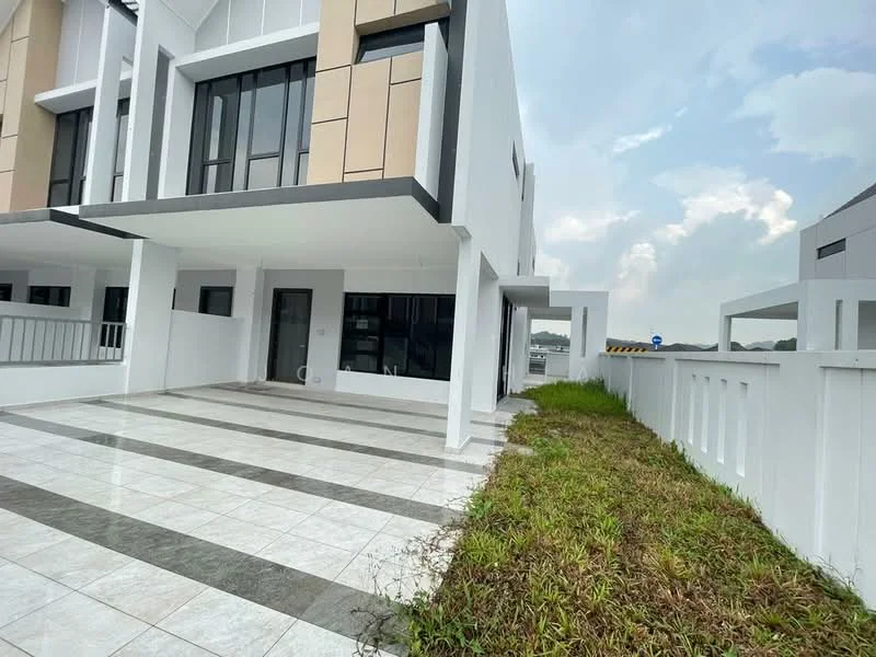 Exterior type: linked terrace house; features: white painted facade, grey accent panels, flat roof, 2-storey building, paved driveway, manicured lawn, surrounded by low fencing, large windows, front porch area, open space beside the house; style: modern.