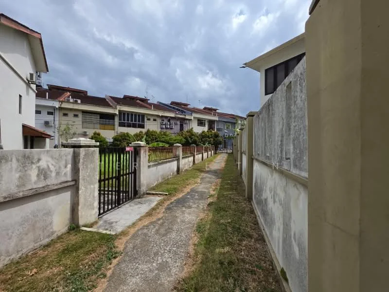 Exterior type: linked terrace house; features: concrete pathway, fenced perimeter, manicured lawn, two-storey houses, gated entrance, surrounded by greenery, cloudy sky; style: modern.