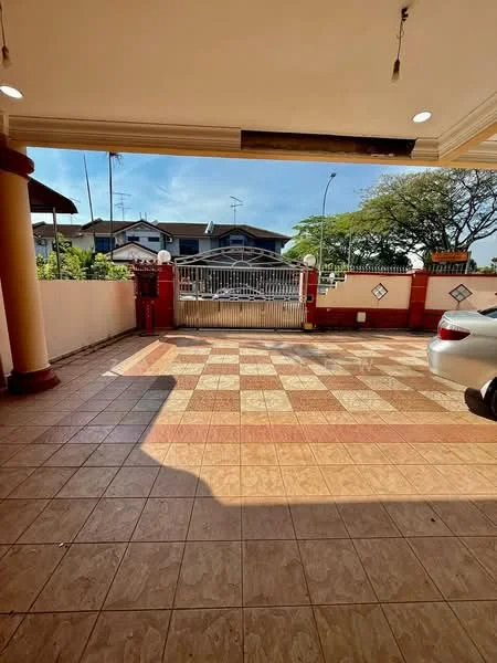 Exterior features: tiled flooring with checkerboard pattern, gate at entrance, surrounding walls, car parked, outdoor lighting, driveway, landscaped area with trees.