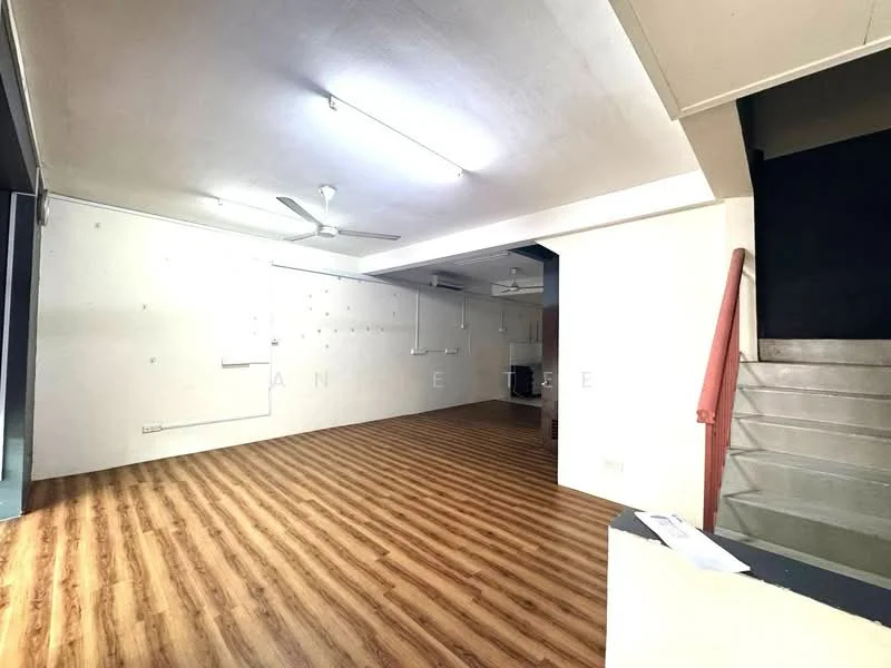 Room features: laminate wood flooring, white painted walls, exposed ceiling with fluorescent lights, 2 ceiling fans, staircase leading to upper level, open layout, no visible furniture, large open space; style: modern.